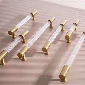 Brass and lucite drawer pulls. Total of 4 (two different sizes)